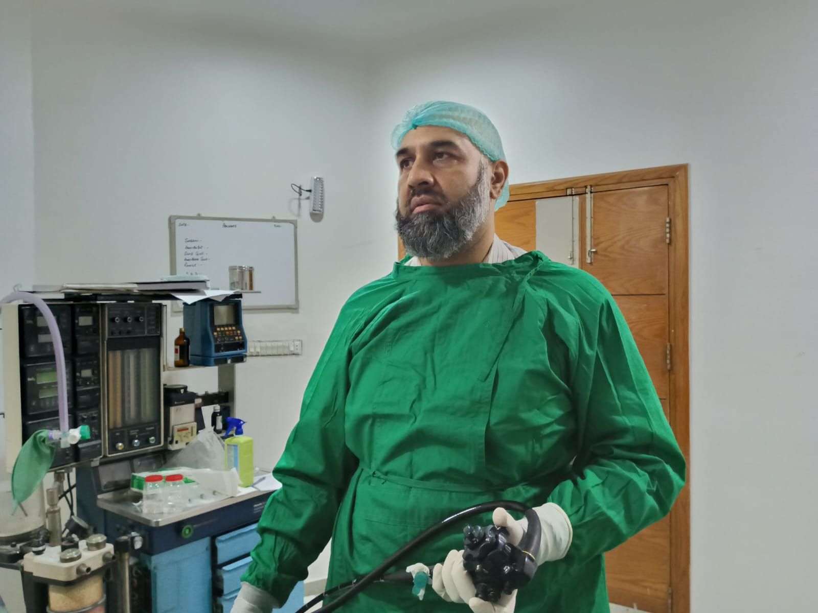 Dr Ali Taj preparing to perform a procedure. 