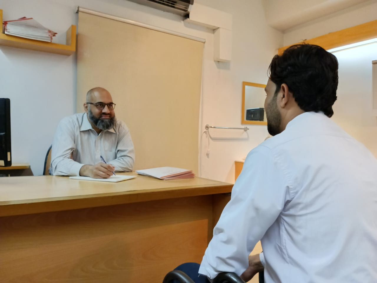 Dr. Muhammad Ali Taj — Consultant Gastroenterologist performing endoscopy at Ziauddin Hospital Karachi